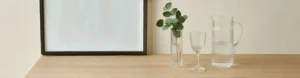Elegant glassware display with vase, goblet, and pitcher – HONORLIVING blog banner “From Concept to Creation