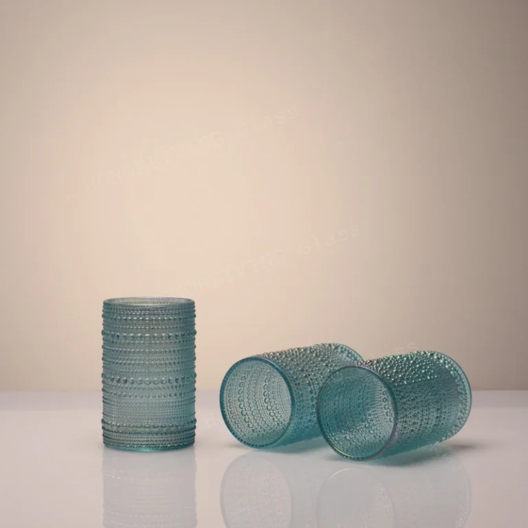 Set of 3 HonorLiving aqua blue beaded glass tumblers: one upright, two tilted.