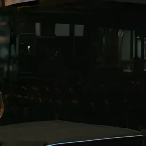 Crystal-clear glassware being crafted in a professional glass manufacturing workshop, combining artisanal techniques and modern automation.