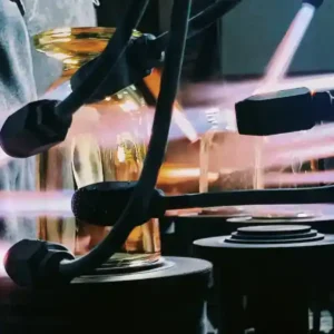 Artisans crafting eco-friendly glass vases from recycled materials in a modern sustainable workshop.