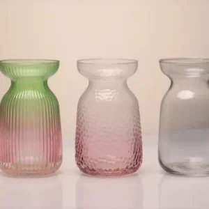 Set of modern gradient glass vases in pink, green, and clear tones showcasing 2025 OEM/ODM glassware design trends and sustainable craftsmanship.