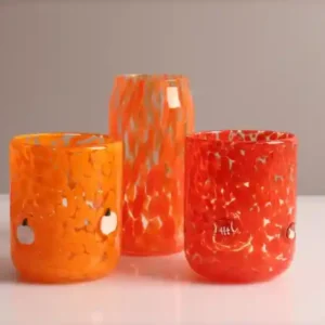 Decorative glass products in amber, clear and smoked finishes showcasing 2025 home decor trends